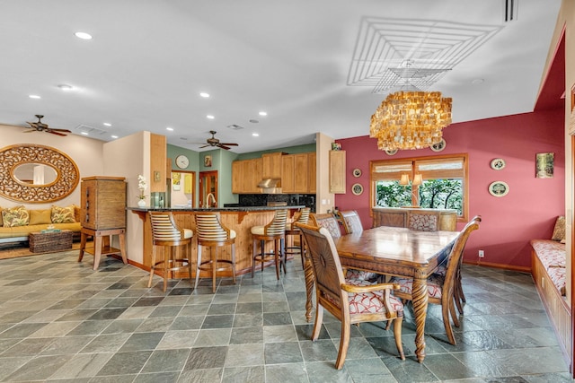 dining room featuring ceiling fan with notable chandelier, baseboards, recessed lighting, and stone tile flooring