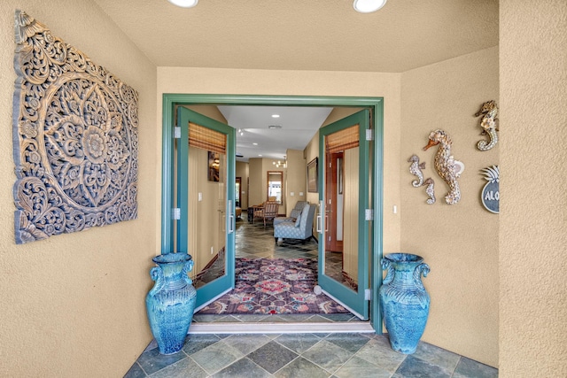 entrance to property with stucco siding