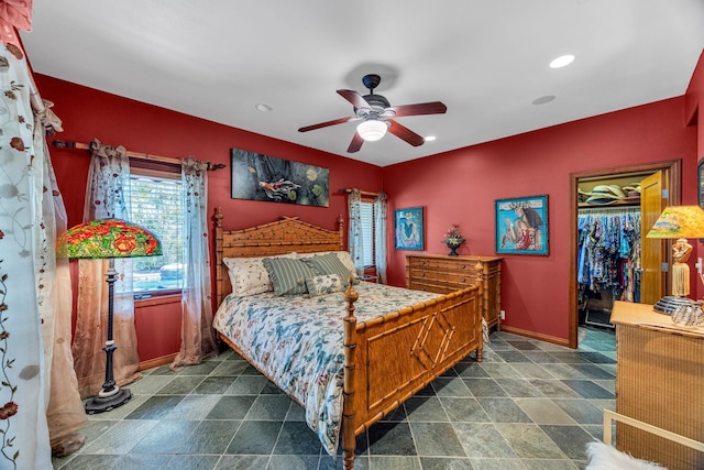 bedroom with a ceiling fan, a closet, a walk in closet, baseboards, and recessed lighting