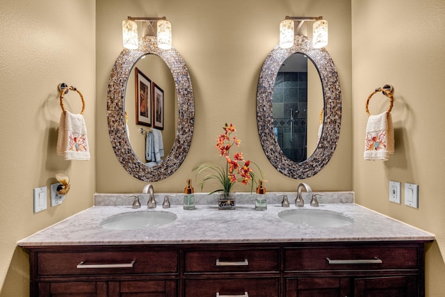 full bath with a sink and double vanity