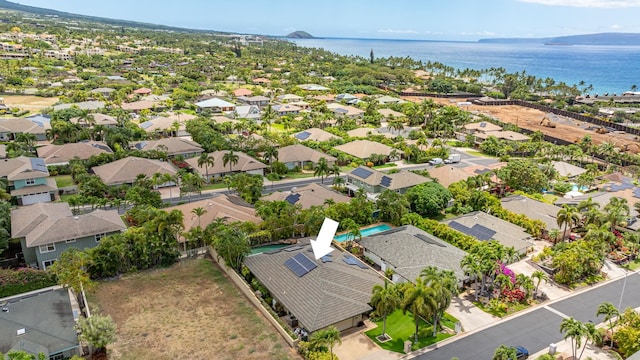 birds eye view of property with a water view and a residential view