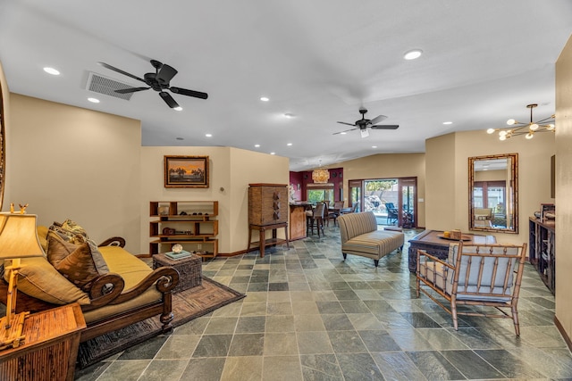 living room with recessed lighting, stone finish flooring, a ceiling fan, and baseboards
