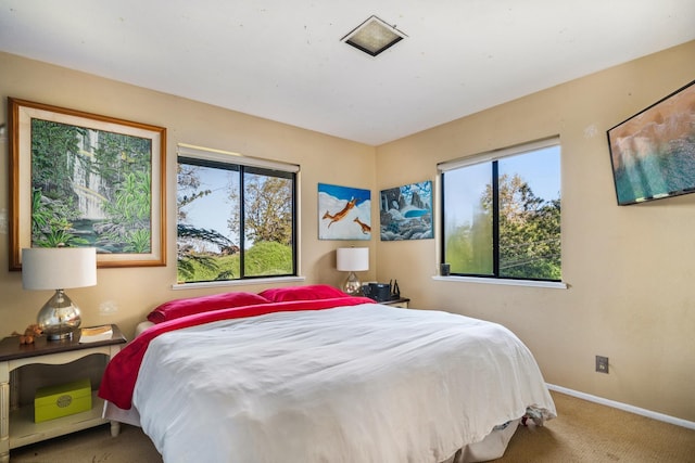 carpeted bedroom with baseboards