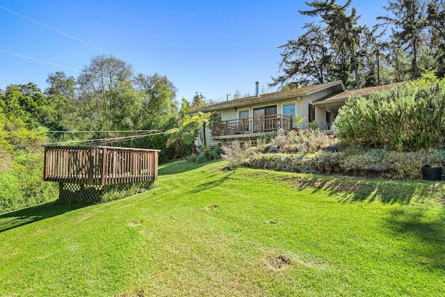 view of yard with a wooden deck