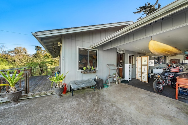 view of side of home featuring a wooden deck