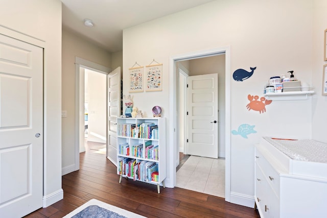 hallway featuring dark hardwood / wood-style flooring