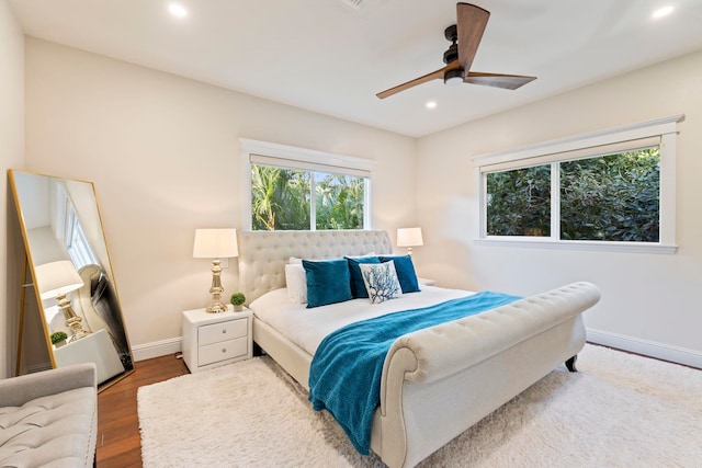 bedroom with ceiling fan and hardwood / wood-style floors