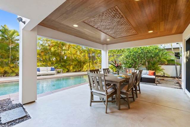 view of patio / terrace with a fenced in pool and an outdoor living space