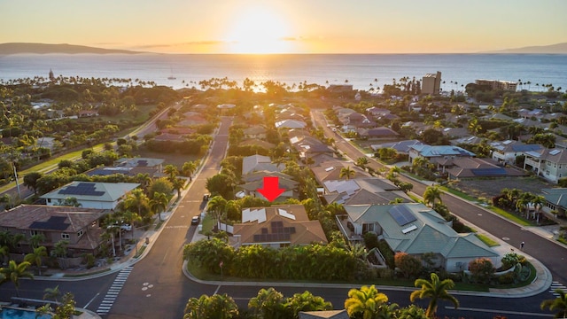 aerial view at dusk with a water view