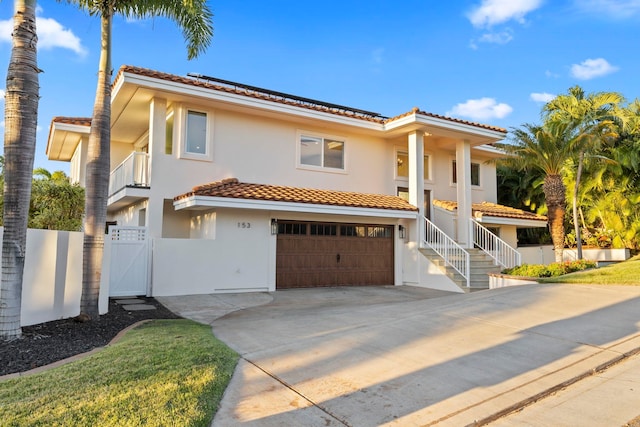 mediterranean / spanish house featuring a garage