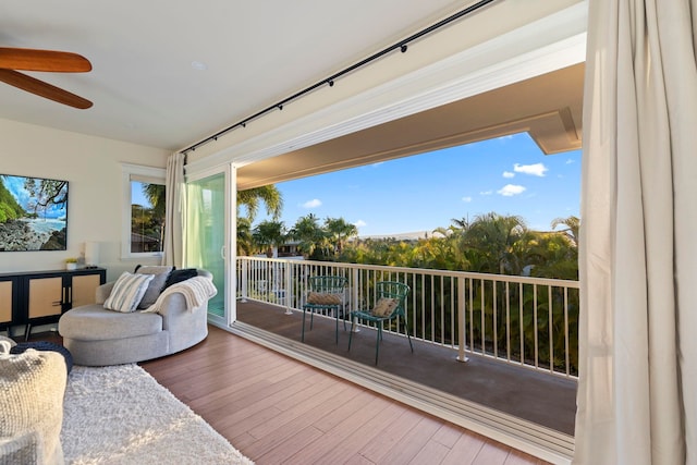 interior space with ceiling fan