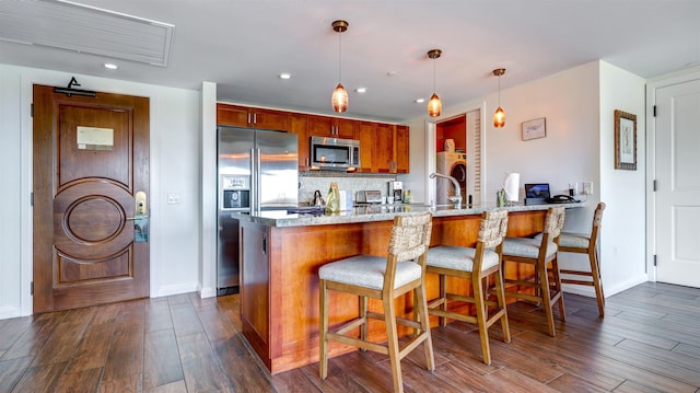 130 Kai Malina Pkwy Unit Nr1026, Lahaina, HI 96761 - kitchen featuring stainless steel appliances, a peninsula, dark wood finished floors, recessed lighting, and baseboards