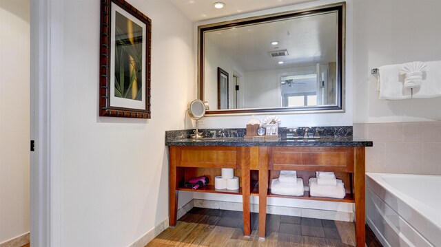 130 Kai Malina Pkwy Unit Nr1026, Lahaina, HI 96761 - full bath with double vanity, wood finished floors, a bathtub, recessed lighting, and a ceiling fan