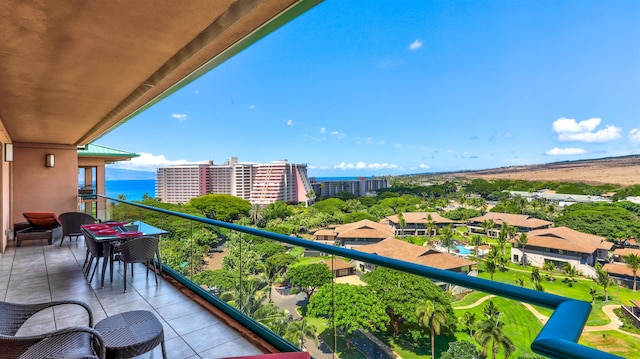 balcony featuring a water view