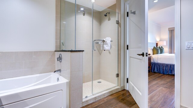 130 Kai Malina Pkwy Unit Nr1026, Lahaina, HI 96761 - ensuite bathroom featuring a stall shower, wood finished floors, a garden tub, ornamental molding, and recessed lighting