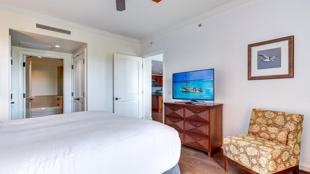 130 Kai Malina Pkwy Unit Nr1026, Lahaina, HI 96761 - bedroom with ornamental molding, wood finished floors, connected bathroom, and ceiling fan