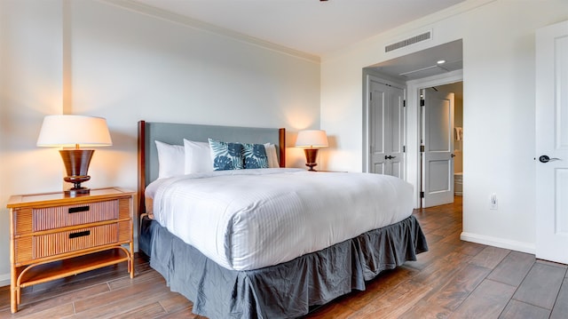 130 Kai Malina Pkwy Unit Nr1026, Lahaina, HI 96761 - bedroom with ornamental molding, wood finished floors, and baseboards