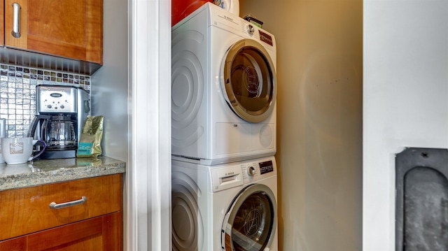 laundry room featuring stacked washing maching and dryer