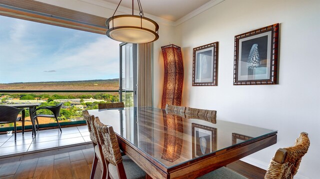 130 Kai Malina Pkwy Unit Nr1026, Lahaina, HI 96761 - dining room with ornamental molding, dark wood finished floors, and baseboards