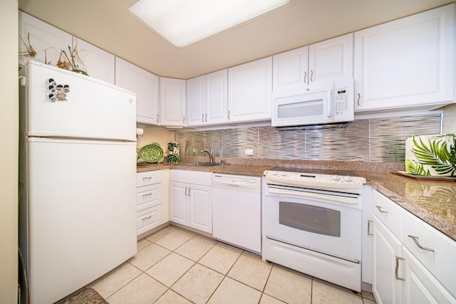 kitchen featuring white cabinetry, sink, white appliances, decorative backsplash, and light tile patterned flooring