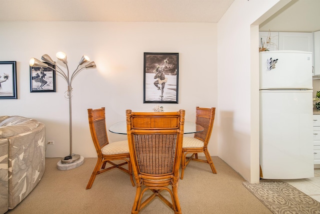 view of carpeted dining space