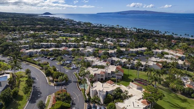 drone / aerial view with a water and mountain view