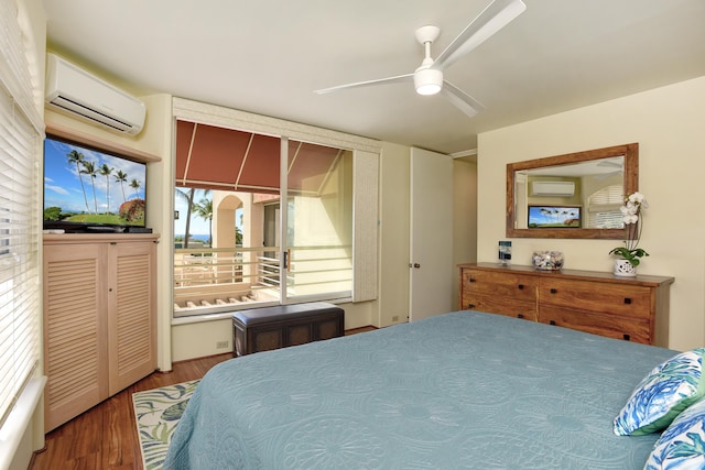 bedroom featuring hardwood / wood-style floors, a wall mounted AC, and ceiling fan