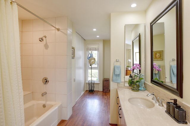 bathroom featuring shower / bath combo with shower curtain, vanity, and wood-type flooring