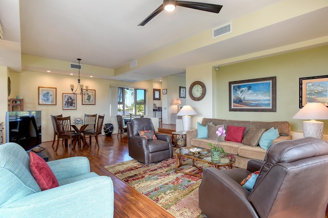 living room featuring ceiling fan and dark hardwood / wood-style floors