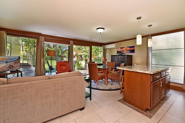 interior space featuring an AC wall unit, light tile floors, and a wealth of natural light