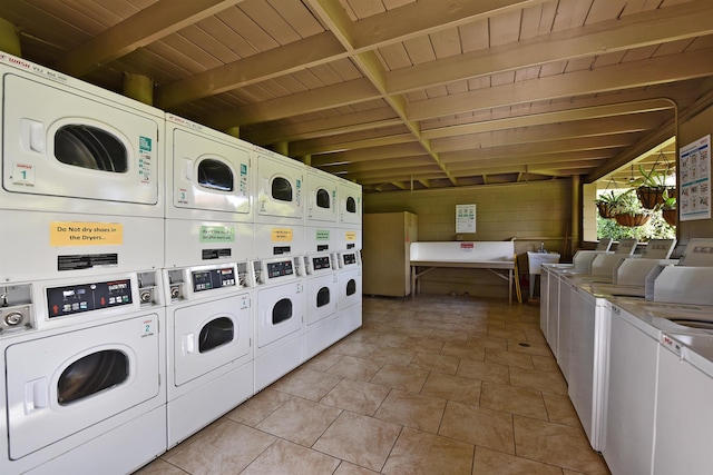 washroom with stacked washer / drying machine, separate washer and dryer, and light tile floors