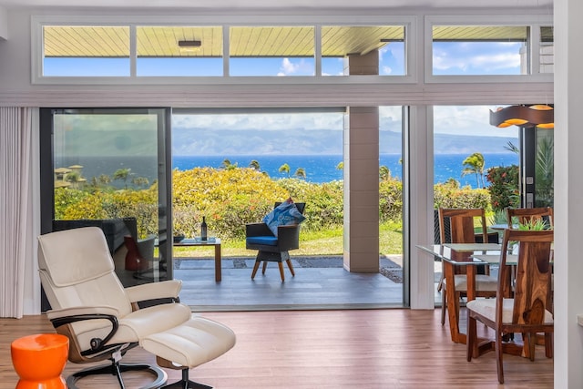 100 Ridge Rd Unit 2612, Lahaina, HI 96761 - sitting room with wood finished floors, expansive windows, healthy amount of natural light, and a water view