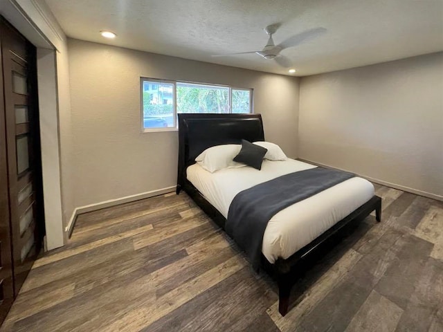 bedroom with recessed lighting, wood finished floors, baseboards, and ceiling fan