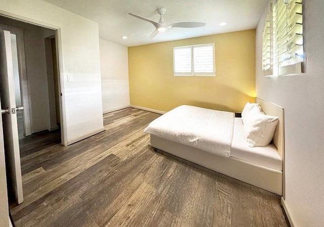 bedroom featuring a ceiling fan, recessed lighting, wood finished floors, and baseboards