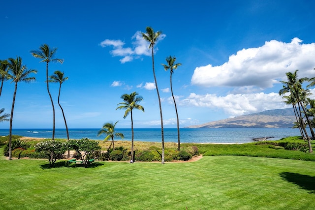 surrounding community featuring a yard and a water and mountain view