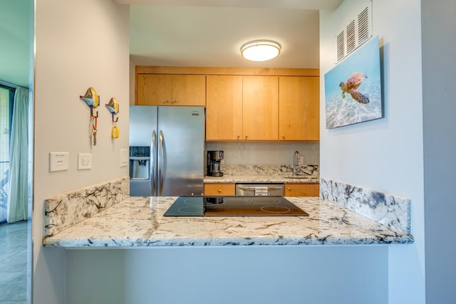 kitchen featuring appliances with stainless steel finishes, sink, tile floors, and backsplash