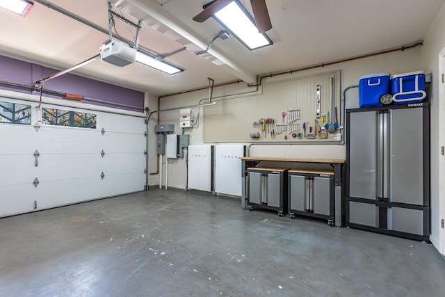 garage featuring a workshop area and a garage door opener