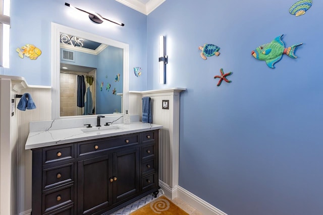 bathroom featuring vanity and crown molding