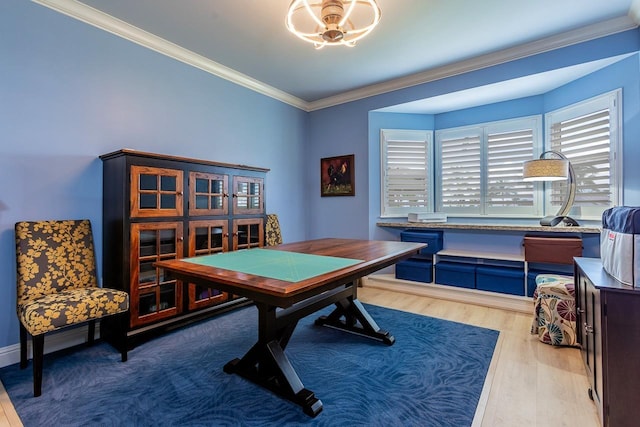 recreation room with crown molding and hardwood / wood-style floors