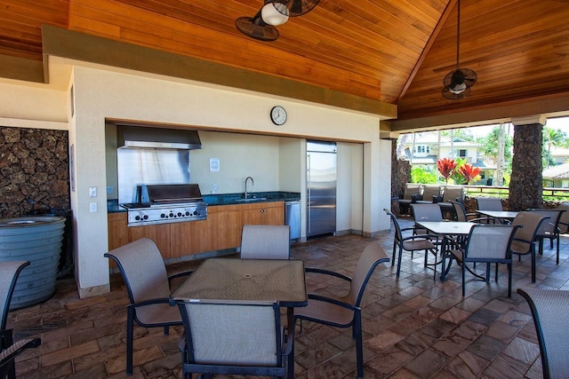 view of patio / terrace featuring ceiling fan, area for grilling, and sink