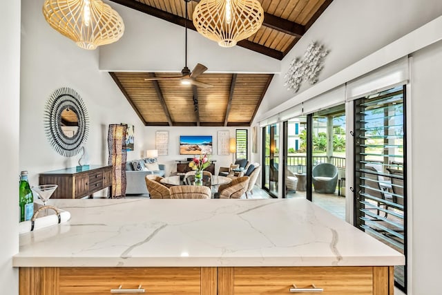 10 Wailea Ekolu Pl Unit 1204, Kihei, HI 96753 - kitchen with a wooden ceiling with exposed beams, ceiling fan, open floor plan, light stone countertops, and high vaulted ceiling