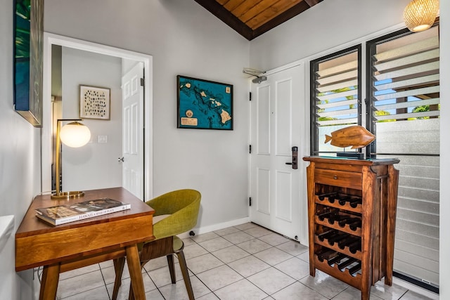 entryway with light tile patterned floors, vaulted ceiling, and wood ceiling