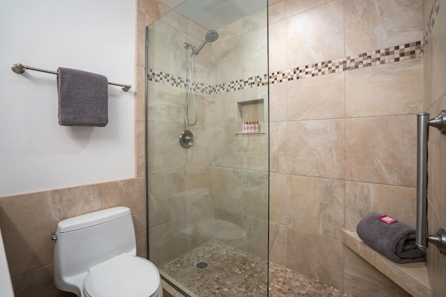 10 Wailea Ekolu Pl Unit 1204, Kihei, HI 96753 - full bathroom featuring walk in shower, wainscoting, and tile walls