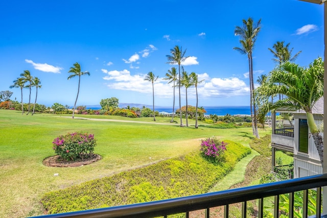 view of community featuring a yard and a water view