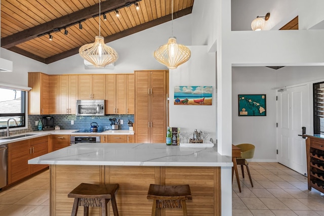 kitchen with sink, wooden ceiling, a kitchen breakfast bar, kitchen peninsula, and appliances with stainless steel finishes