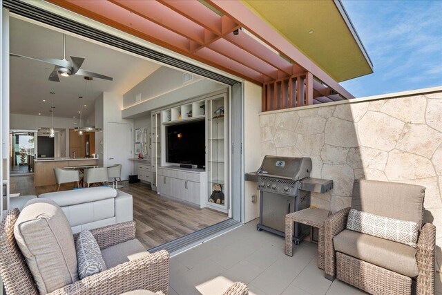 209 Holokahiki Ln Unit 103, Kihei, HI 96753 - view of patio / terrace with grilling area and a ceiling fan