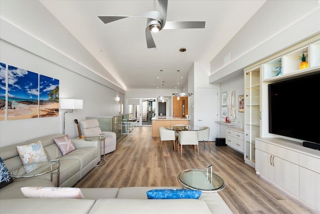 209 Holokahiki Ln Unit 103, Kihei, HI 96753 - living area featuring visible vents, light wood finished floors, ceiling fan, and high vaulted ceiling