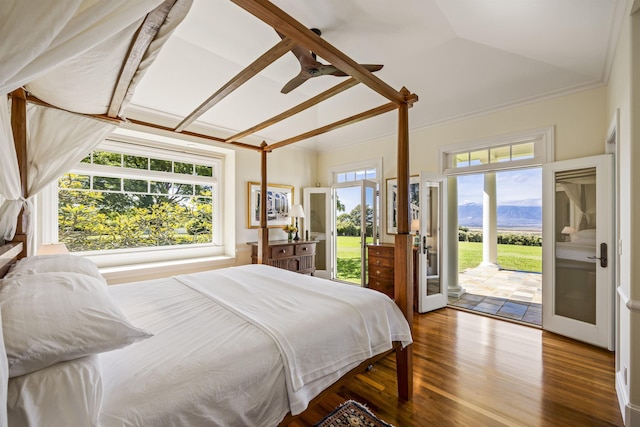 bedroom with access to exterior, ceiling fan, a mountain view, hardwood / wood-style floors, and lofted ceiling