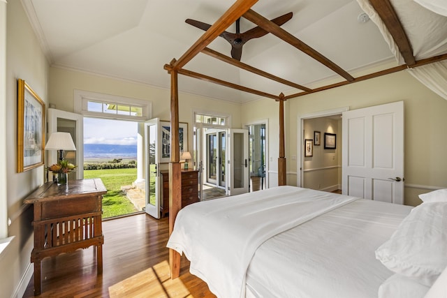 bedroom with ceiling fan, dark hardwood / wood-style floors, lofted ceiling, access to outside, and ornamental molding