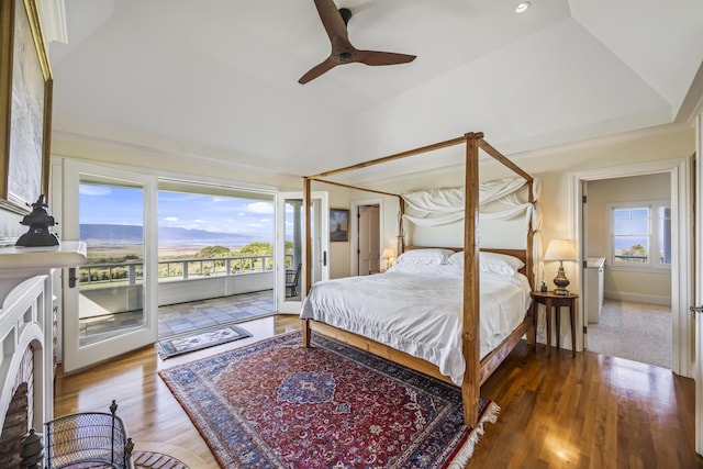 bedroom featuring light wood-type flooring, access to outside, multiple windows, and ceiling fan